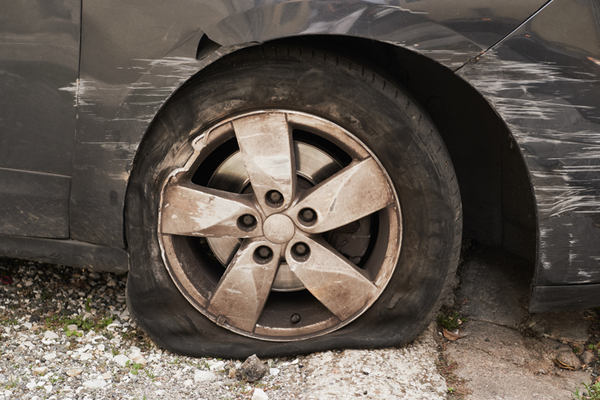 Tire rim damaged by pot holes like those in Erie, PA.